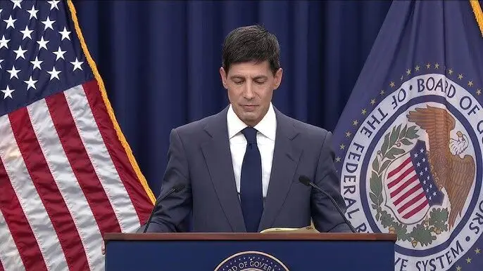 Kevin Warsh reading the FOMC statement at the Federal Reserve podium, July 2026